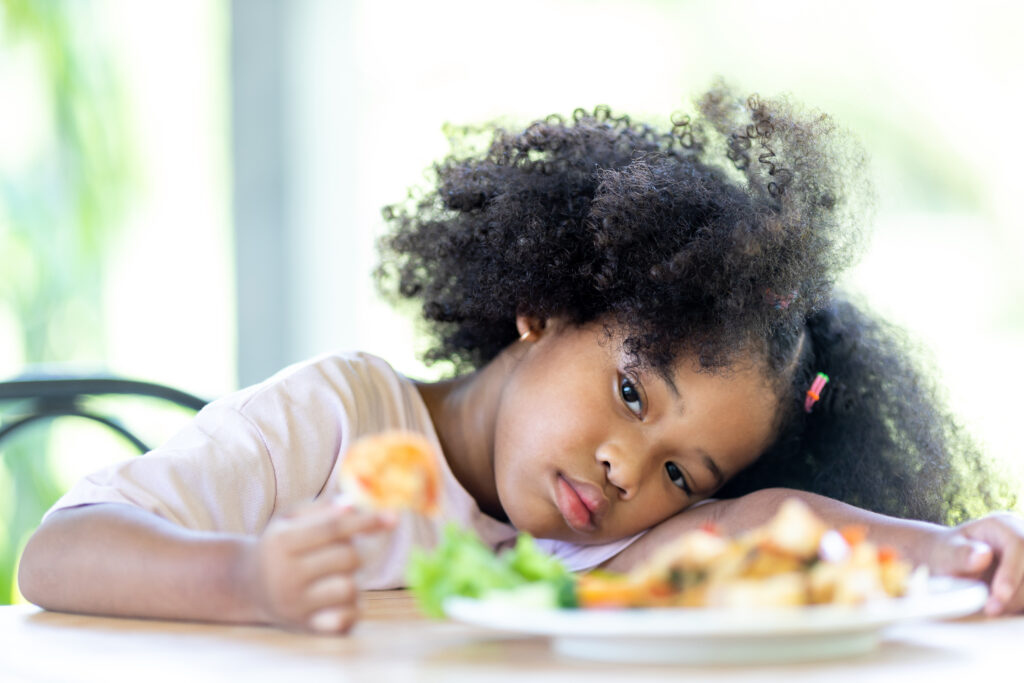 USP: Teen & Child Eating Disorders - Young girl looking uninterested in her food
